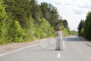 girl in white dress on the road