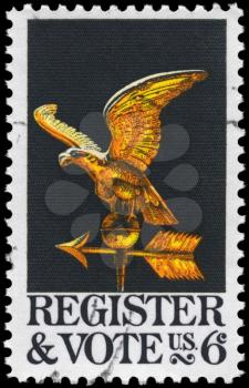 Royalty Free Photo of 1968 US Stamp Shows the Eagle Weather Vane, Register and Vote Issue