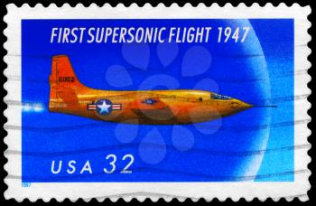 Royalty Free Photo of 1997 US Stamp Shows the First Supersonic Flight, 50th Anniversary