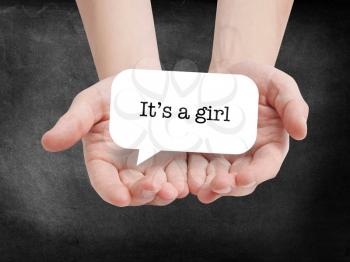 Its a girl written on a speechbubble