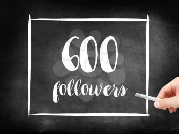 600 followers written on a blackboard