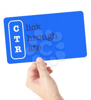 Click Through Rate explained on a card held by a hand