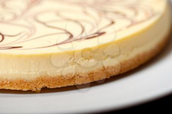 fresh baked classic Cheese cake with chocolate topping 