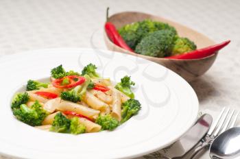 classic Italian penne pasta with broccoli and red chili pepper