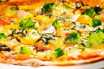 fresh italian thin style  vegetarian pizza with fresh mixed vegetables close up