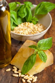 Italian basil pesto ingredients over old wood macro