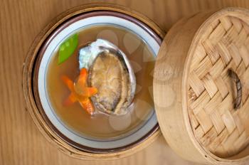 Japanese style abalone soup  on bamboo bowl set holder