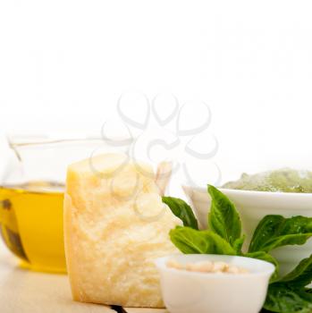 Italian traditional basil pesto sauce ingredients on a rustic table