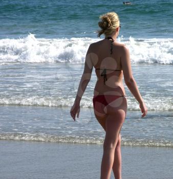 Royalty Free Photo of a Woman Walking on the Beach