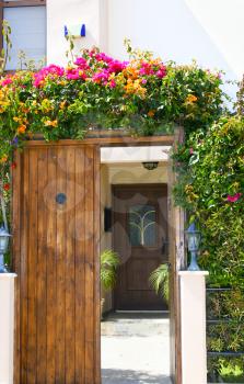 Royalty Free Photo of a Building Entrance With Flowers