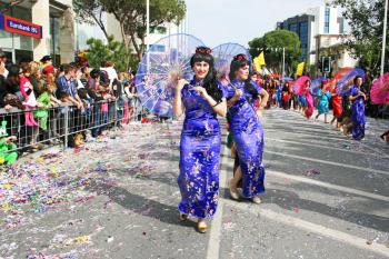 Royalty Free Photo of People Wearing Costumes Performing in a Parade