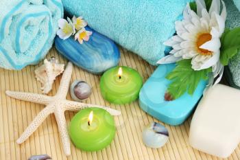 Royalty Free Photo of Candles and Soaps by Towels