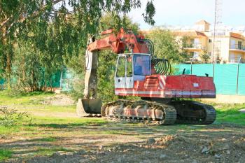 Royalty Free Photo of a Red Dredge in a Rural Landscape