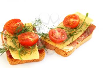 Sandwiches with bacon, cheese, cherry tomato and dill isolated on white background.