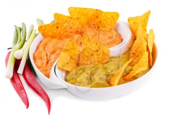 Nachos, guacamole and cheese sauce, vegetables isolated on white background.
