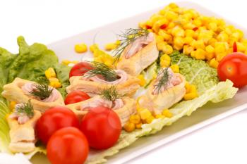 Fish cream in pastries, sweet corn, cherry tomato and lettuce on white plate.