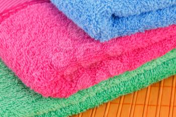 Colorful folded towels closeup picture.