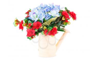 Colorful fabric flowers in watering pot isolated on white background.