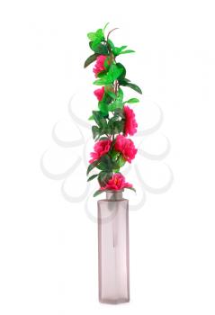 Pink fabric flowers in glass vase isolated on white background.