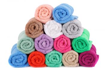 Colorful rolled towels stack isolated on white background.