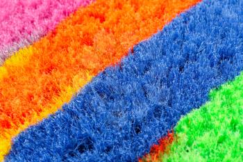 Colorful brooms closeup picture.