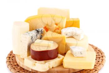 Various type of cheese on wooden board closeup picture.