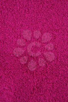 Pink towel texture as a background, closeup picture.