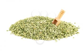 The heap of green split peas with wooden scoop isolated on white background.