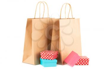 Brown paper shopping bags and gift boxes isolated on white background.