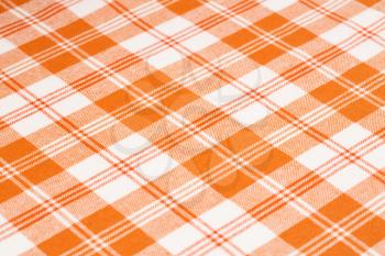 Orange and white kitchen towel texture as a background, vertical picture.