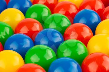 Many colorful plastic balls as a background.