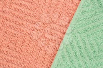Pink and green towels texture as a background.