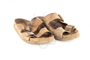 The pair of man old brown leather sandals isolated on white background.