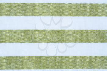 Green and white kitchen towel texture as a background, horizontal image.