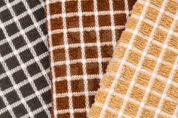 Brown, black and beige towels texture as a background.