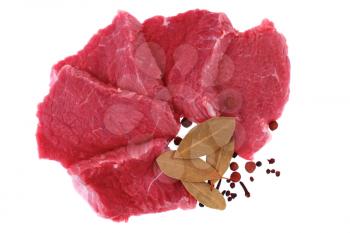 Cut of  beef steak  with  laurel and  flavouring. Isolated.