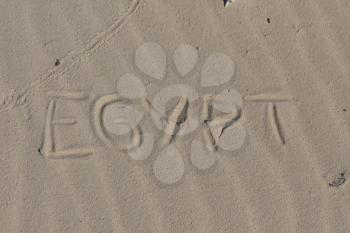 Inscription  Egypt on a sand n a  beach.