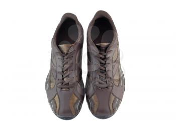 Pair of leather brown sneakers.  Isolated over white.