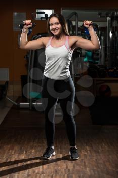 Young Woman Working Out With Kettle Bell