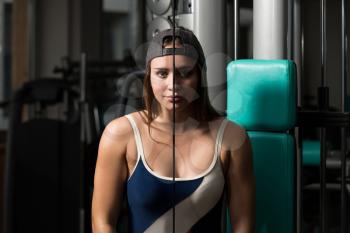 Young Woman Doing Heavy Weight Exercise For Triceps