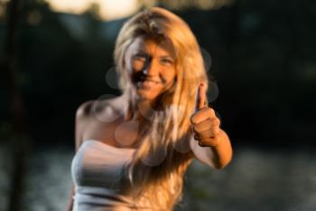 Young Woman Giving A Thumbs Up