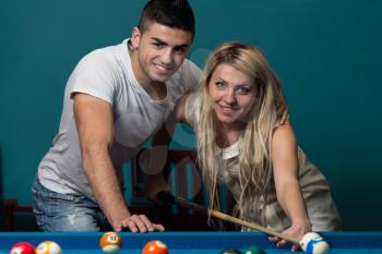 Beautiful Couple Playing Pool