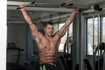 Healthy Man Exercising His Abs At The Gym