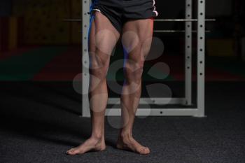 Close-Up of Bodybuilders Legs Ready For Competitive Sport
