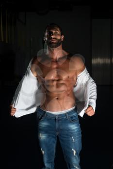 Portrait Of A Sexy Muscular Man In Pants And Shirt Posing