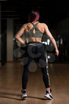 Portrait Of A Young Physically Fit Woman Showing Her Well Trained Body - Beautiful Athletic Fitness Model Posing After Exercises