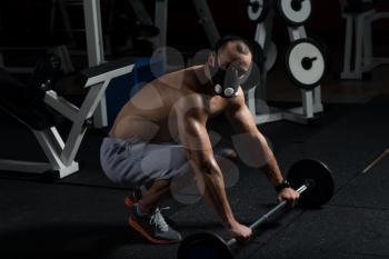 Bodybuilder Doing Push Ups On Barbell As Part Of Bodybuilding Training In Elevation Mask