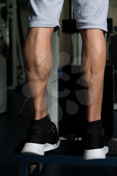 Bodybuilders Legs Shot Close Up In A Gym In Workout