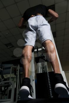 Bodybuilders Legs Shot Close Up In A Gym In Workout