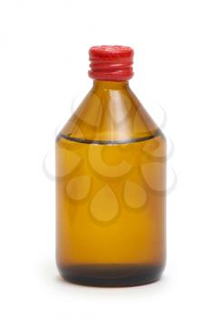 Royalty Free Photo of a Brown Bottle With a Red Lid